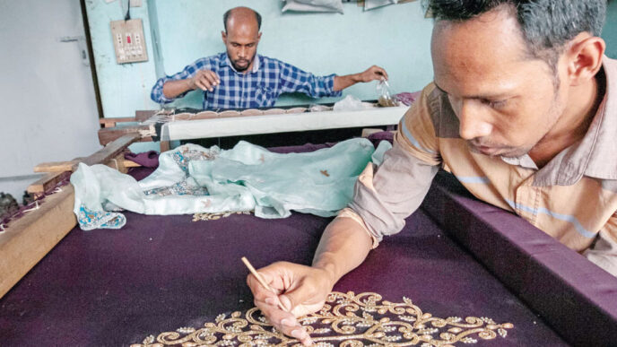 Artisans work on intricate designs on women’s clothing at a small shop in Pahartali area of Chattogram. Many such small-scale enterprises have complained that they are not being able to access loans under a government stimulus package dedicated to them, even after applying multiple times in the last two years. Photo: Rajib Raihan