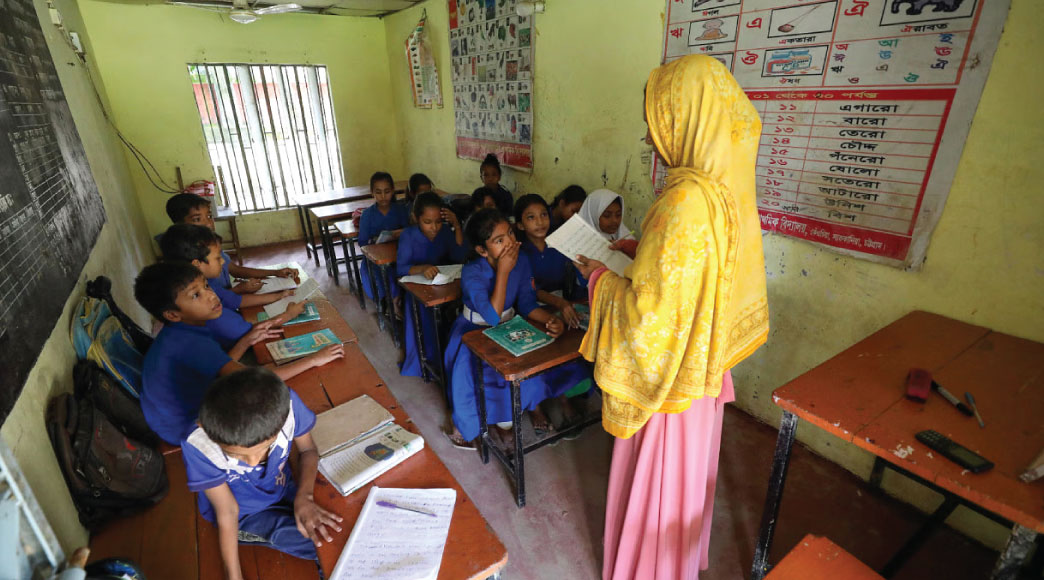 Classes have resumed in schools at Chattogram’s Satkania upazila following the recent flood. However, only a small number of students have returned to classrooms as many families are still coping with the aftermath of the flood. The photo was taken in Madarbari Nayapara Govt Primary School yesterday. Photo: Rajib Raihan