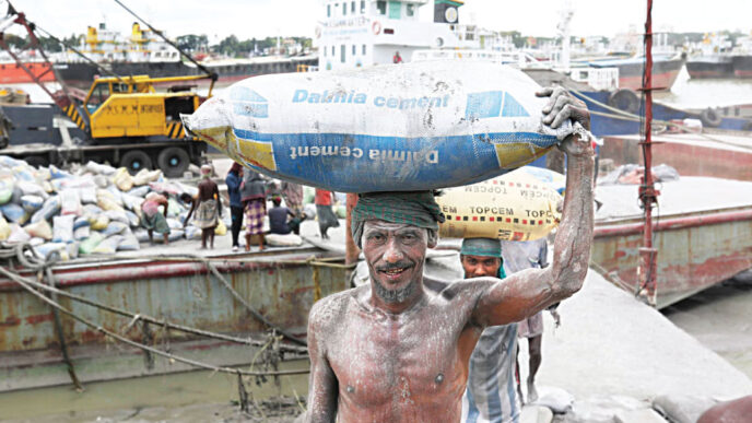 Workers unloading raw materials of cement from a vessel in Chattogram. Bangladesh imports cement raw materials such as clinker, granulated slag, limestone flux, gypsum and fly ash from Thailand, Vietnam and China. Photo: Star/file