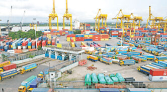 Although the Chattogram port is usually teeming with trucks, transport activities have been disrupted in recent days due to flash floods. Activities only resumed partially on Sunday but are yet to pick up as sections along the Dhaka-Chattogram highway were damaged by the deluge. Photo: Star/File